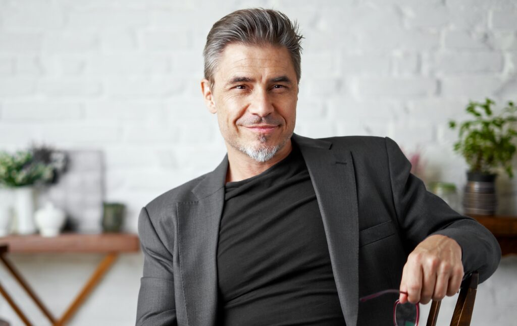 portrait of happy older white man with gray hair