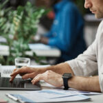 man working at computer in office closeup